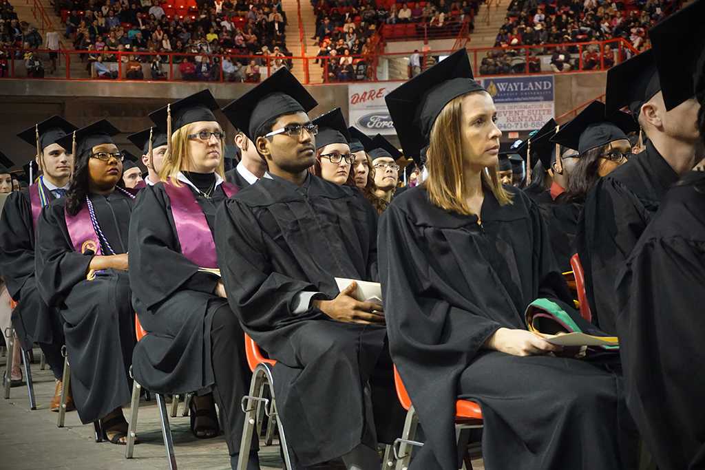 Graduates listen to the guest speaker, James Frank, at the Midwestern State University graduation Dec. 17, 2016. Photo by Brendan Wynne