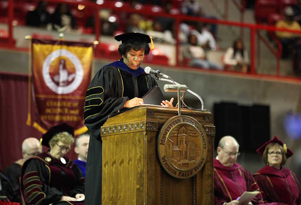 Provost Betty Stewart addresses graduates at the Midwestern State University graduation, Fall 2016. Stewart is leaving in February to be the provost at UNT-Dallas. Photo by Jeanette Perry.