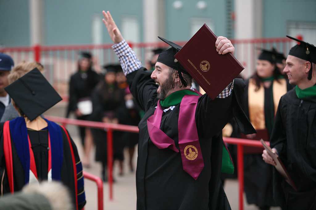 Radiologic sciences major Kyle Morford celebrates after the ceremony at Midwestern State University fall graduation Dec. 17, 2016. Photo by Brendan Wynne
