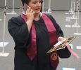 AnnMarie Bush, music, stops to take a phone call before lining up at the Midwestern State University graduation Dec. 17, 2016. Photo by Brendan Wynne