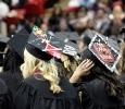Graduates enjoyed decorating their hats for the second time in the schools history at the Midwestern State University graduation, Fall 2016. Photo by Jeanette Perry.