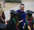 Jeff Killion, radiologic sciences chair, high-fives students after the ceremony at Midwestern State University fall graduation Dec. 17, 2016. Photo by Brendan Wynne