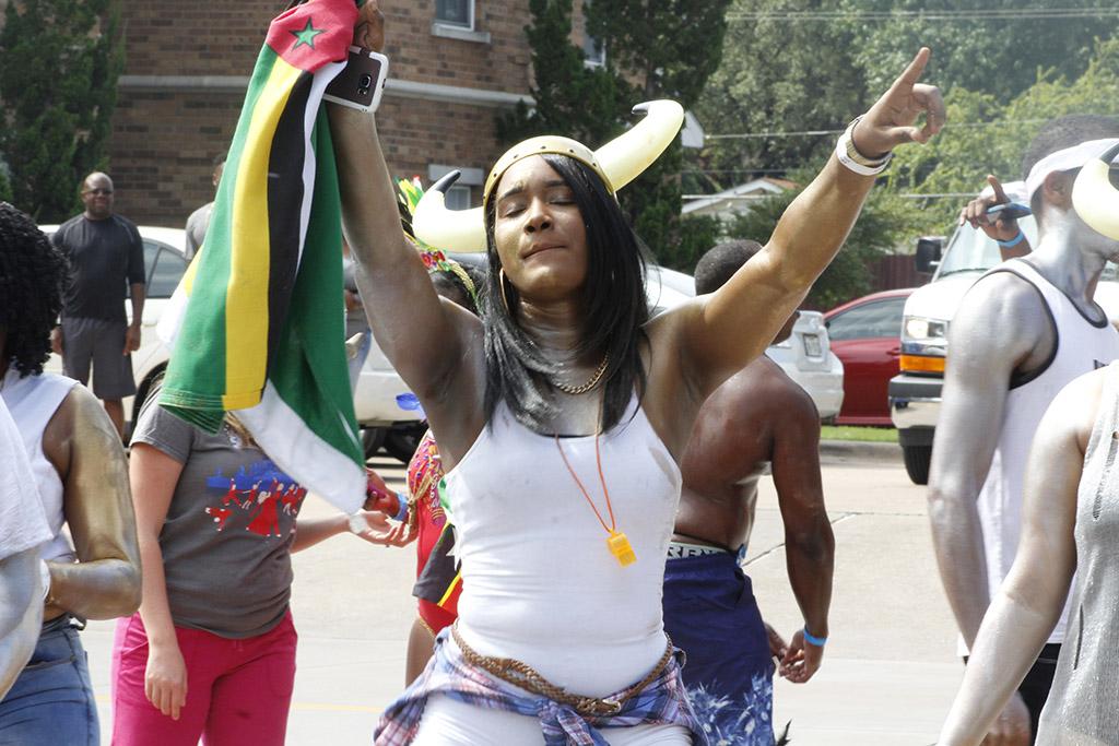 Francine Baron, special education senior, dances with her Dominica flag at Caribfest on Sept.30. Photo by Sara Keeling