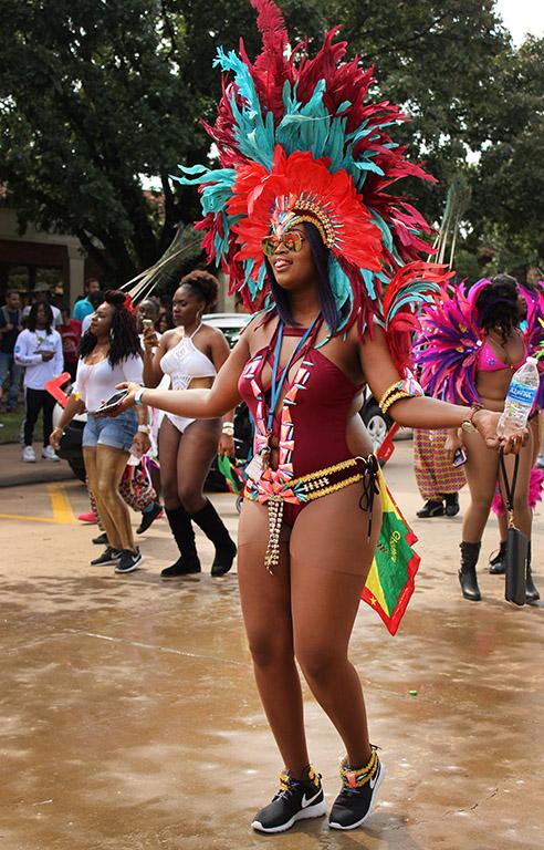 Lidenia Clarke, Spanish junior, shakes her chest for the camera during the Caribfest Parade that looped from Dillard to Jesse Rogers Promenade Sept. 30. Photo by Rachel Johnson