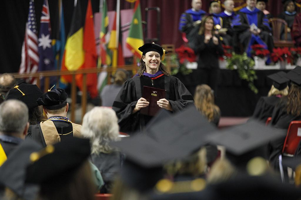 Laura Fidelie, associate professor, receives the Faculty Award during the MSU commencement ceremony at Kay Yeager Coliseum. Saturday Dec. 16, 2017. Photo by Francisco Martinez