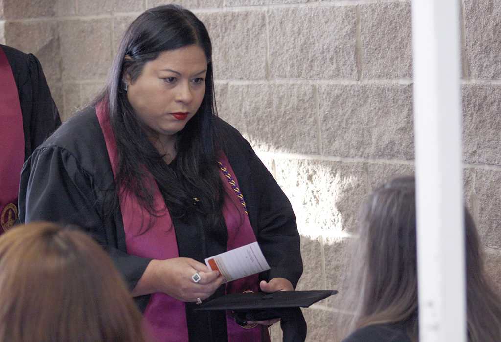 Michelle Castro, BFA graduate, gets her information card at the fall 2017 commencement at the Kay Yeager Colliseum on Sat. Dec. 16, 2017. Photo by Justin Marquart