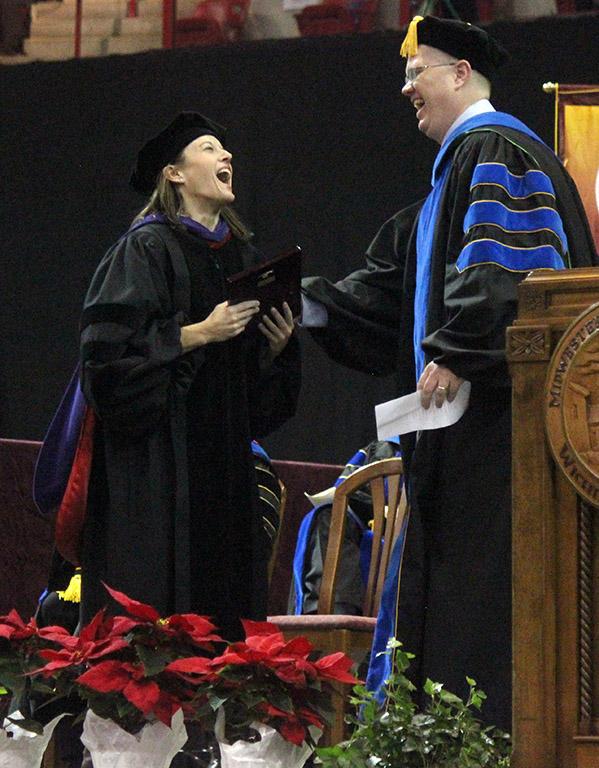 Laura Fidelie, criminal justice professor, wins the Faculty Award, which was presented by David Carlston, faculty senate chair, at the beginnning of Commencement in Kay Yeager Coliseum, Sat. Dec. 16, 2017. Photo by Rachel Johnson