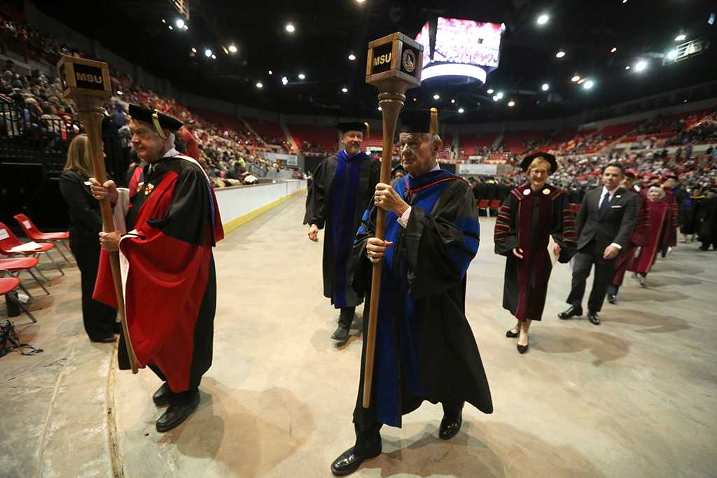 After the ceremony, the longest-serving faculty members Evertt Kindig and Harry Hewitt led the recessional. Photo by Bradley Wilson
