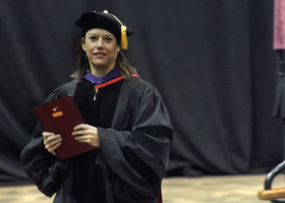 Laura Fidelie, assosiate profesor for criminal justice, recieves the faculty award at the fall 2017 commencement at the Kay Yeager Colliseum on Sat. Dec. 16, 2017. Photo by Justin Marquart
