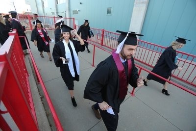 Graduating seniors walk in to the Kay Yeager Coliseum at graduation, Dec. 16, 2017. Photo by Bradley Wilson