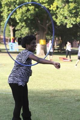Candace Bledsoe, nursing freshman, hoolahoops on the quad at the homecoming field day competitions in an attempt to take a break from studying on Oct 18, 2017. Photo by Sara Keeling