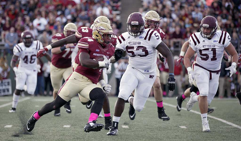 Vincent Johnson, mechanical engineer junior, rushes the ball during the MSU vs West Texas A&M game at Memorial Stadium, Saturday, Oct. 21, 2017. Photo by Francisco Martinez