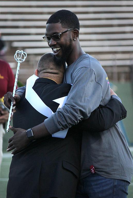 Juan Mercado, sociology senior, hugs his friend and the 2016 Homecoming Kind Charles Frazier, 2016 graduate, after finding out that Mercado was the 2017 Homecoming King. Photo by Rachel Johnson