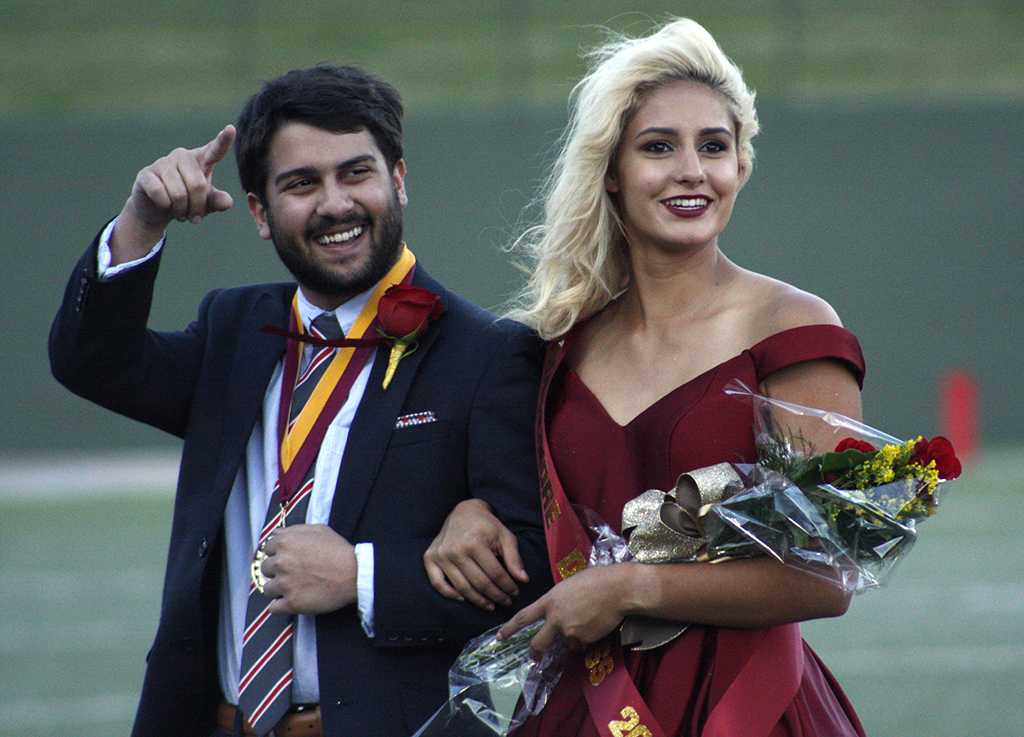 Imran Kurani, political science sophomore, and Lauren Gardner, pre med sophomore, the duke and duchess on the field during halftime of the homecoming game against West Texas where the Mustangs won 45-3 at Memorial stadium on Saturday, Oct. 21, 2017. Photo by Justin Marquart