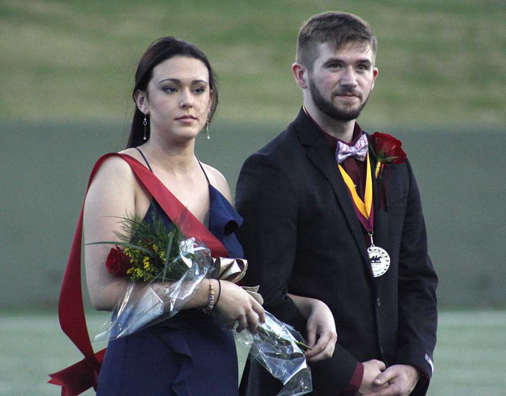 Sarah Wood, marketing junior, and Jeffrey Hamon, exercise physiology junior, the prince and princess on the field during halftime of the homecoming game against West Texas where the Mustangs won 45-3 at Memorial stadium on Saturday, Oct. 21, 2017. Photo by Justin Marquart