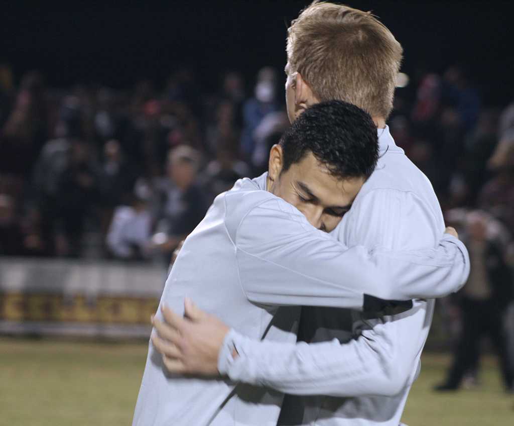 Midfielder and business management sophomore embraces defender and business sophomore RJ Slayer, after MSU wins 2-0 against Colorado School of Mines in the NCAA Division II South Central Regional Championships. Nov 16. Photo by Bridget Reilly