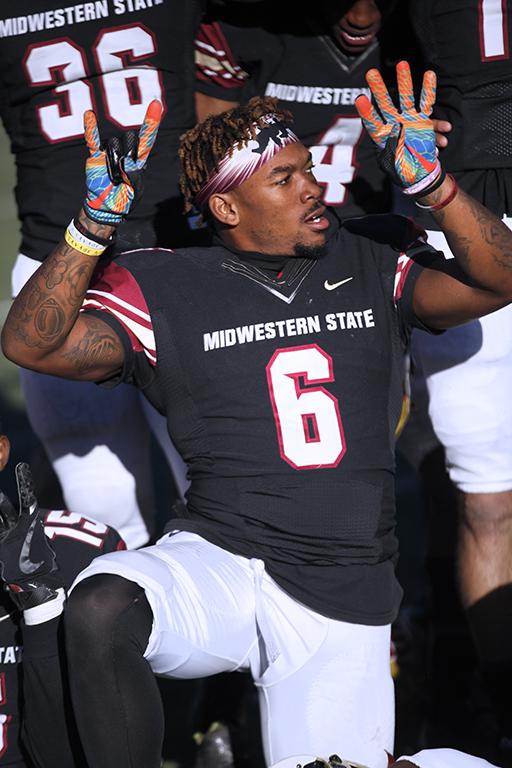 Wide receiver and applied arts and science senior Brandon Sampson, holds up a 2 and a 4 on his fingers in honor of Robert Grays, where MSU won 24-20 against University of Sioux Falls in the first NCAA Division II playoff game. Nov 18. Photo by Bridget Reilly