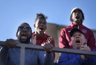 Alonzo Burris, exercise physiology senior, Jacoby Thomas, accounting freshman, Justin Harper, education sophomore, and Juan Mercado, sociology senior, cheer on the MSU football team at the NCAA II Round One Playoffs game against University of Sioux Falls at Memorial Stadium. Photo by Rachel Johnson