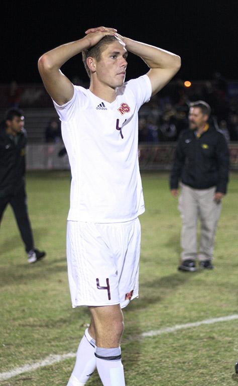 Patrick Fitzgerald, kinesiology junior, puts his hand on his head after a close game with two overtimes and 6 rounds of penality kicks against Cal Poly Pomona, where they won 6-5 in the PK shoot out. Photo by Rachel Johnson