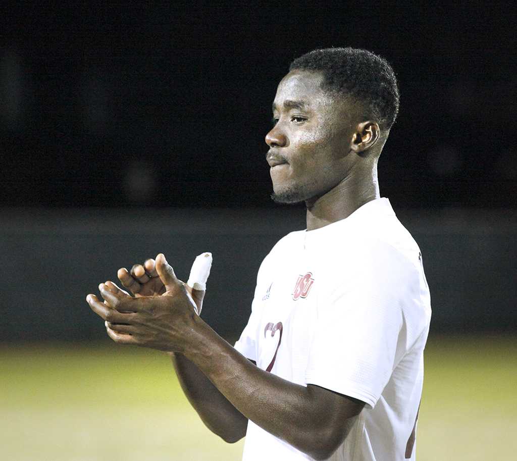 Midfielder and business administration sophomore Saad Acheampong applauding after six rounds of penalty shootouts, losing 6-5 in the NCAA Division II Championship playoff against Cal Poly Pomona. Nov 18. Photo by Bridget Reilly
