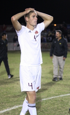 Patrick Fitzgerald, kinesiology junior, puts his hand on his head after a close game with two overtimes and 6 rounds of penality kicks against Cal Poly Pomona, where they won 6-5 in the PK shoot out. Photo by Rachel Johnson