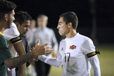 Midfielder and sports medicine freshman Carlos Flores shakes the hand of a Cal Poly Pomona player, after six rounds of penalty shootouts, losing 6-5 in the NCAA Division II Championship playoff. Nov 18. Photo by Bridget Reilly