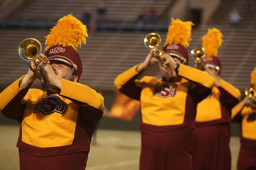 Computer science junior Cory Michener and other trumpet players perform at the Midwestern State football game, Aug. 31, 2017, against Quincy, Illinois. MWSU won 53-6 in the season opener. Photo by Bradley Wilson