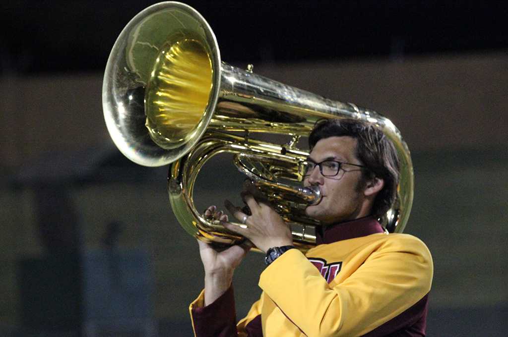 Timothy Harrel, music education junior, preforms in the half time show during the game against Texas A&M Kingsville at Memorial Stadium Sept. 16. Photo by Rachel Johnson