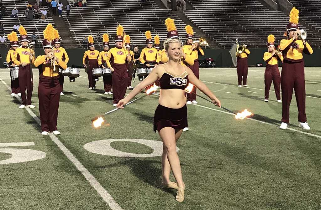 Alexis Maggard, twirler, at the Midwestern State football game, Aug. 31, 2017, against Quincy, Illinois. MWSU won 53-6 in the season opener. Photo by Bradley Wilson
