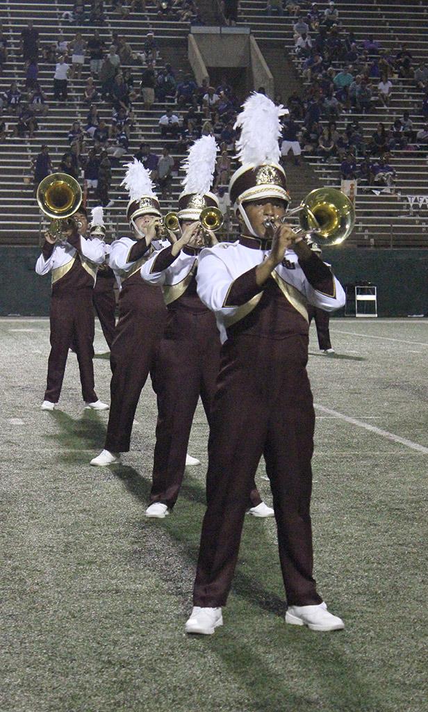 Diondre Chapman, biology freshman, playsin the halftime show in the opening game of the 2015 season at Memorial Stadium, Sept. 5. They preformed the Alma Mater, a tribute to band Queens, and the Fight Song. Midwestern State beat Truman State University 31-3. Photo by Rachel Johnson