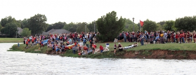 Students line their boats up along the edge of the water of Sikes Lake for the 2017 Homecoming Boat Race, Friday Oct. 20, 2017. Photo by Rachel Johnson