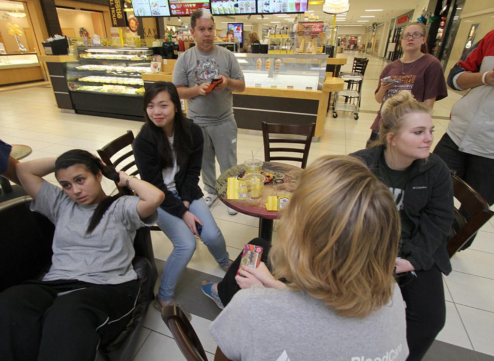 Students gather in the mall after a bomb threat forced the evacuation of the campus Dec. 8. Photo by Lauren Roberts