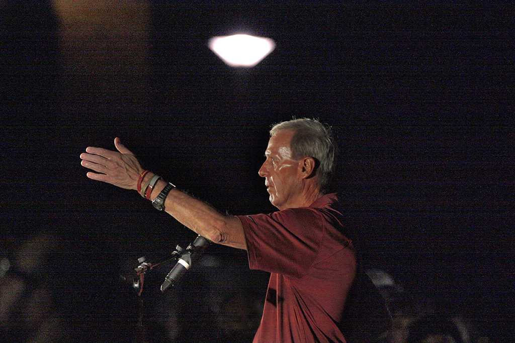 Bill Maskill, head football coach, speaks at the candle light vigil in honor of Robert Grays, , on the Jesse Rogers Promenade on Sept. 21.  Photo by Justin Marquart