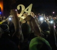 Students holding up No. 24 at the candlelight vigil remembering Robert Greys on Jesse Rogers Promenade on Sept. 21. photo by Elias Maki