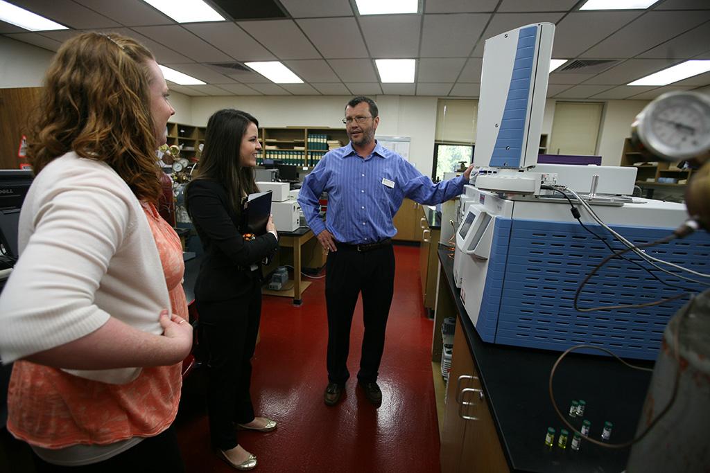 Chris Hansen, associate professor of chemistry, discusses new equipment that former Provost Betty Stewart helped to fund. Photo by Bradley Wilson.