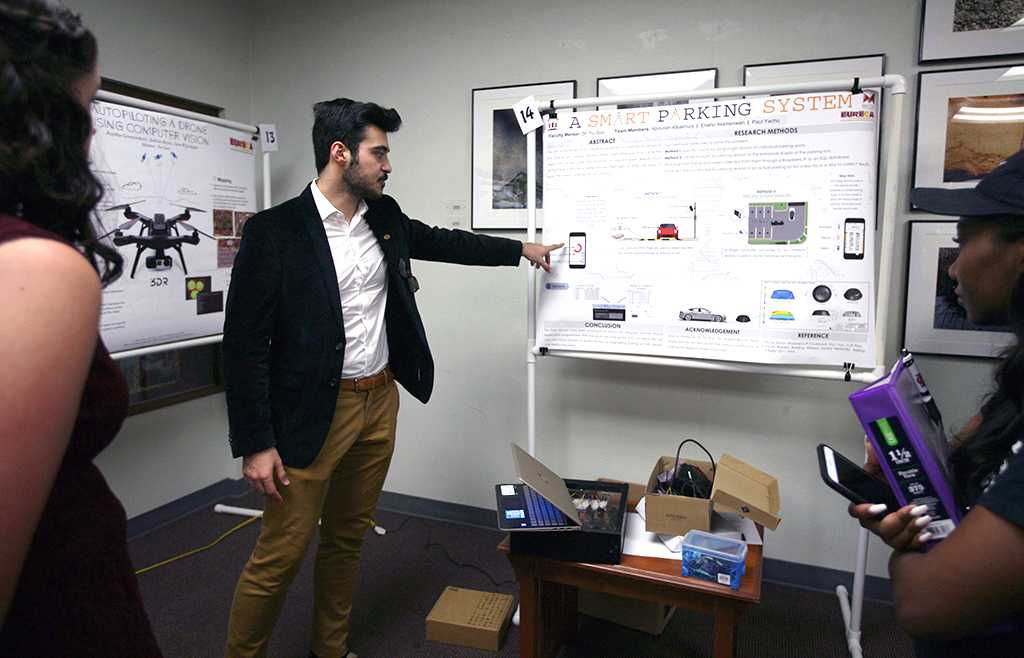 Abdullah Albakhurji, mechanical engineering senior, presents his research on a smarter parking system during EUREKA on April 27. Photo by Arianna Davis