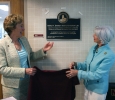University President Suzanne Shipley and Board of Regents member Nancy Marks unveil the palque in honor of former provost Betty Stewart in Bolin hall. Photo by Bradley Wilson