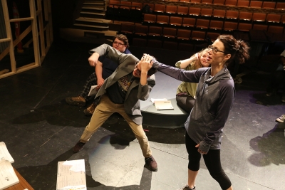 Christie Maturo demonstrates how to pull hair in a fight with Chris Cruz at "Urinetown" rehearsal Jan. 31. Photo by Bradley Wilson