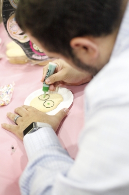 Mario Ramirez, student involvement interim director, decorates a skull shaped cookie during the Dia de los Muertos event held by multiple organizations in the Atrium, Wednesday, Nov. 1, 2017. Photo by Francisco Martinez