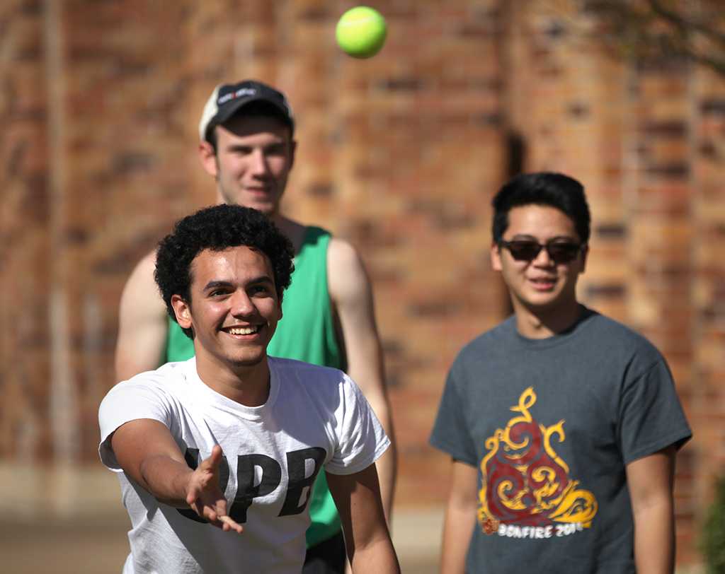 Jorge Santons, undecided fresmen, throws a tennis ball to Tanner Conley, general business freshmen, during the Drunk Goggle Relay on March 15, put on by housing for Alcohol Awareness Month. Photo By Dewey Cooper