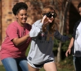 Tia Joyner, geology sophomore, spins Nicole Longely, education freshmen, as Longely prepares to run in the Drunk Goggle Relay finals on March 15. Photo By Dewey Cooper