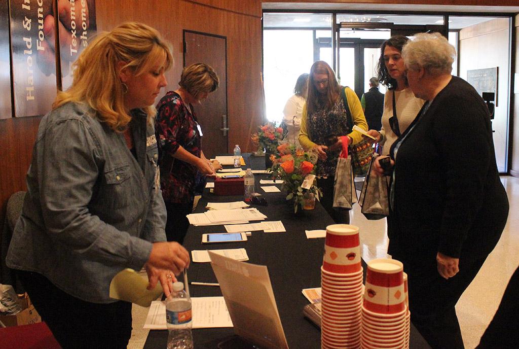 Attendees check-out at the front desk during the Empty Bowls of Wichita Falls at Wichita Falls Museum of Art at MSU, Oct. 10, 2017. Photo by Francisco Martinez