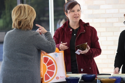 D'Ann Delcoure, 8th Street Coffee House vendor, collects her student made bowl during the Empty Bowls of Wichita Falls at Wichita Falls Museum of Art at MSU, Oct. 10, 2017. Photo by Francisco Martinez