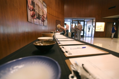 The Silent Auction, apart of Empty Bowls Gallery Reception, was right in the front of Wichita Falls Museum of Art at MSU so that different people who attended could bid on the bowls that artists submitted. Photo by Rachel Johnson