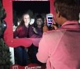 Kedisa Alexander, accounting senior, takes Kendall Stewart's, respiratory therapy junior, and Lisa Nyirenda's, accounting sophomore, picture during the Fantasy of Lights Opening Ceremony, Monday night infront of the Hardin Building. "My favorite thing about this was that it get's me in the mood for Christmas," Stewart says.