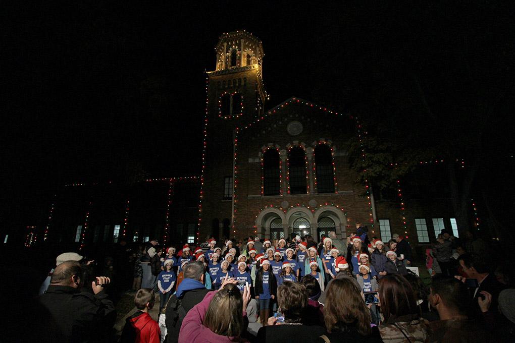 The Ben Franklin Elementary School choir sing christmas songs at the MSU-Burns Fantasy of Lights opening ceremony Monday night in the front lawn of the Harden Administration building. The fantasy of lights has individual displays with themes or characters from children's stories, fairy tales and holiday themes. The fantasy of lights display opened early this year before Thanksgiving and will continue through Dec. 28. The lights turn on at dusk and turn off at 10 p.m. Sunday through Thursday and 11 p.m. Friday and Saturday. Photo by Lauren Roberts