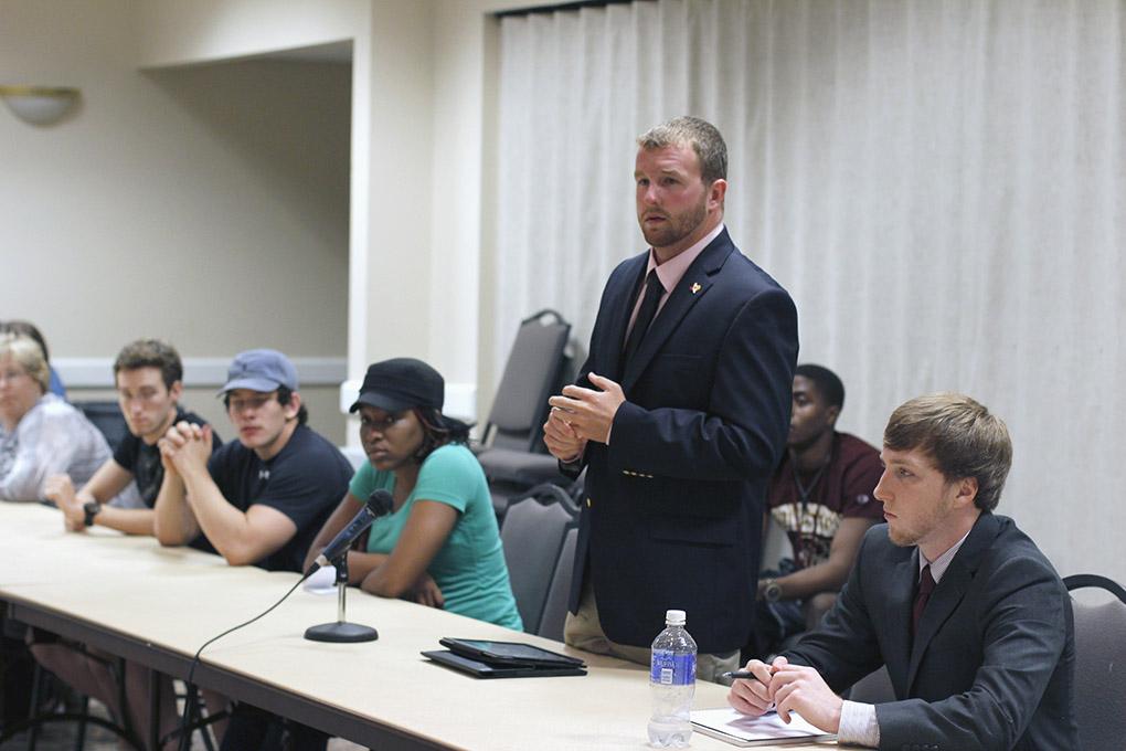 Jesse Brown, junior in criminal justice and business, talks to student senators at the first Student Government Association meeting Tuesday night about the plans to beautify the school, build a dorm and a parking garage. Brown is the student regent appointed by Governor Rick Perry. Photo by Lauren Roberts