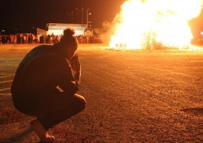 Cameron O'Neal, pre-med sophomore, gets a picture of the Homecoming Bonfire Thursday, Oct. 19, 2017. Photo by Rachel Johnson
