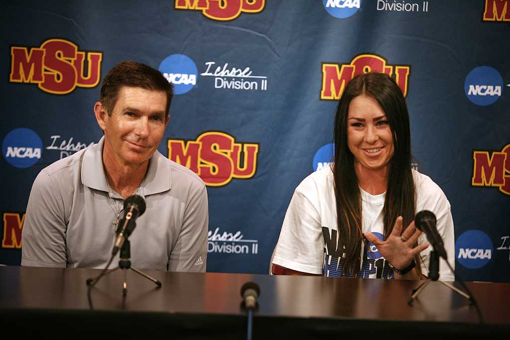 Brenna Moore, nursing senior, and Jeff Ray, golf coach, speak at a press conference with Moore discussing her national championship in golf, the first nationalship won by a Midwestern State University athlete. Photo by Bradley Wilson