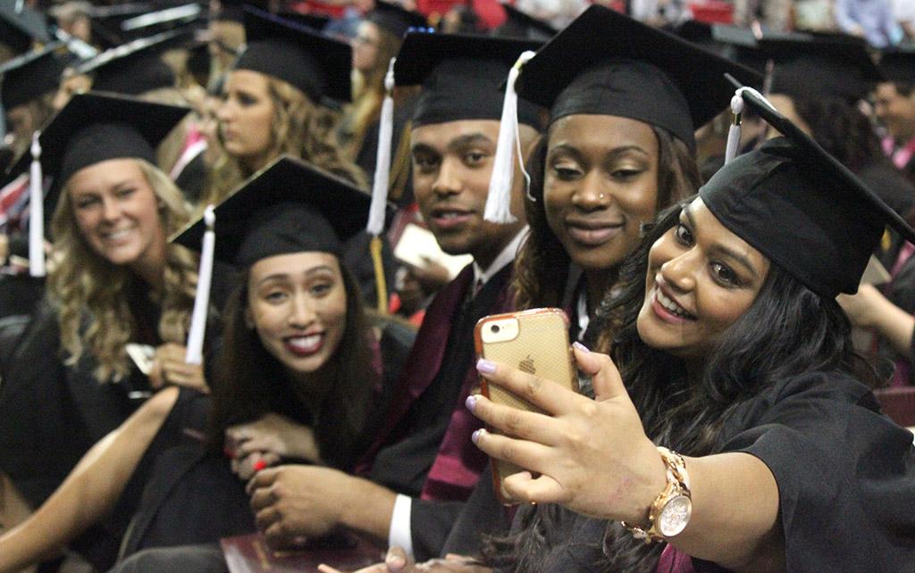 Mass Communication graduates take a selfie after walking the stage together at Commencement, held in the Kay Yeager Coliseum, May 14. Photo by Rachel Johnson